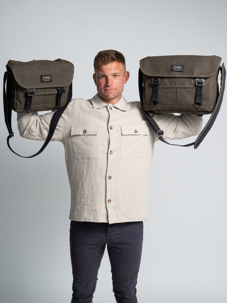a man holding a Bairn Messenger in his right hand and the Bairn Pro Messenger in his left hand to show the size difference