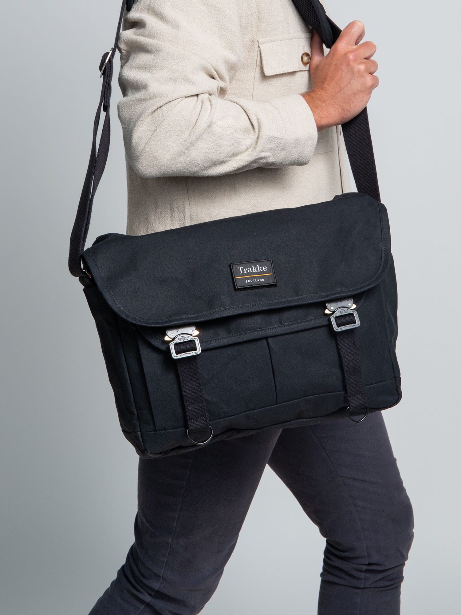 a man carrying a black Bairn Pro Messenger