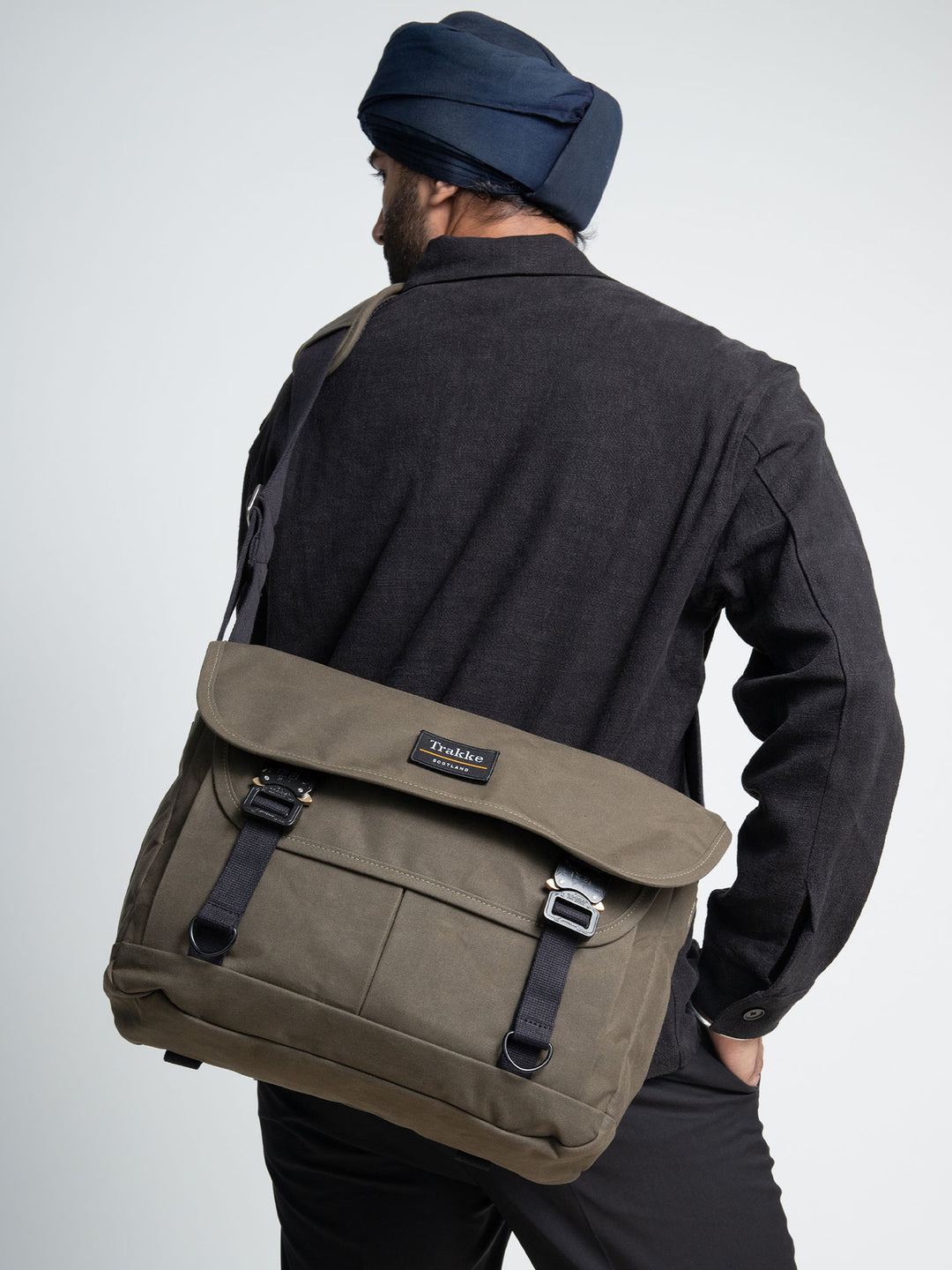 a person with an olive coloured Bairn Pro Messenger on their back